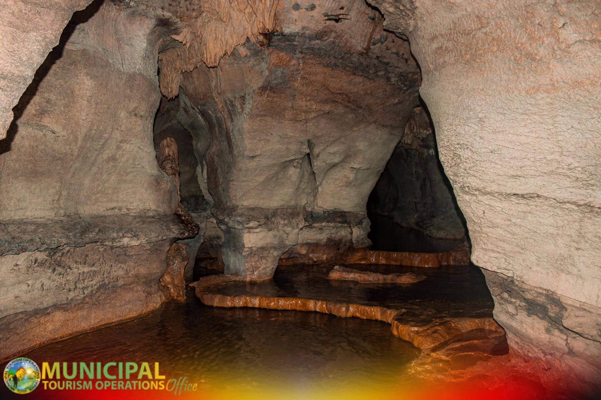 <b class="font-bara"><i class="bi bi-geo-fill h4"></i> UGNOP CAVE</b> <br/>Ugnop Cave is located at Prk. 1 Barangay Tina, San Miguel, Surigao del Sur. This cave has a clear water and surrounded of  stalagmite and stalactite.
Disclaimer: This site is NOT YET OPEN to the PUBLIC.
                   : For future Tourism Product Development.